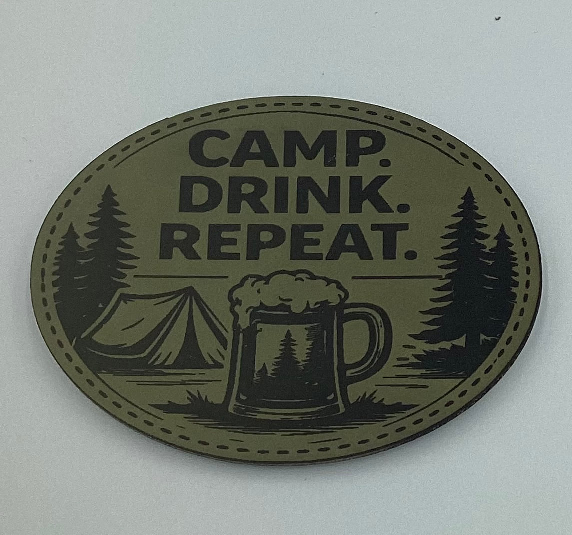 Oval-shaped metal sign with 'Camp. Drink. Repeat.' text, mug illustration, and camping scene on a white background.