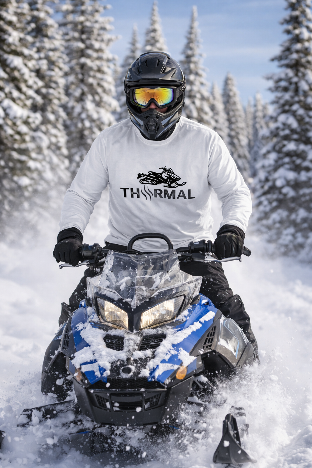 Person riding a snowmobile in a snowy landscape with 'THRMAL' branded clothing.